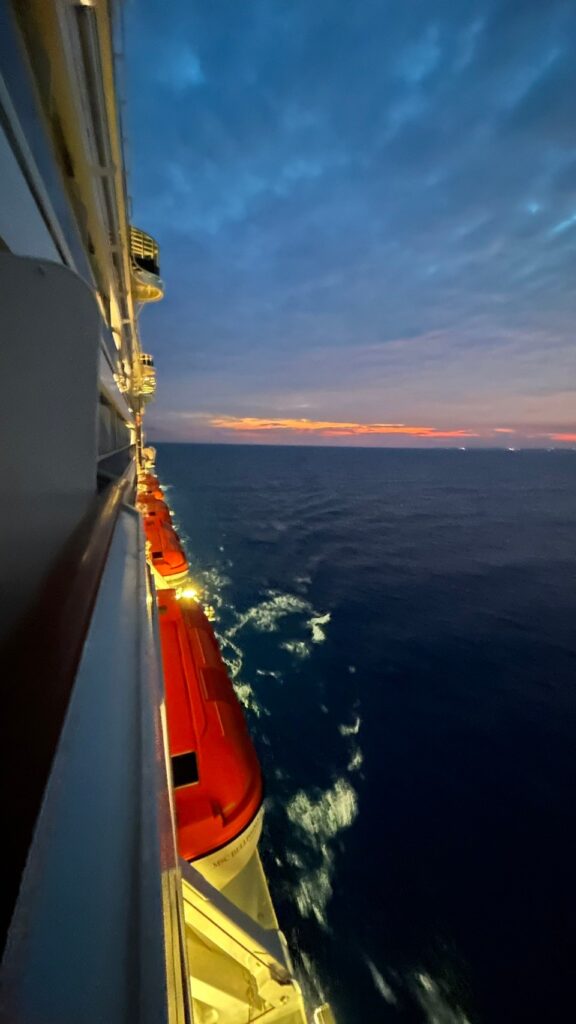 The morning view on the ship, with the red being lifeboats that can each accommodate 267 people.