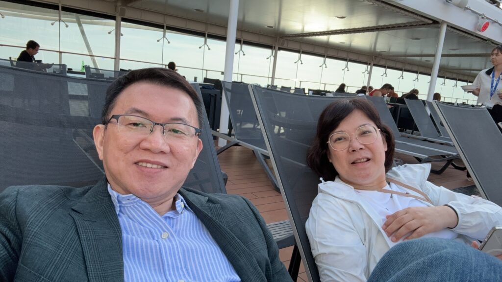 Li-Xiu and I resting on the lounge chairs by the pool.