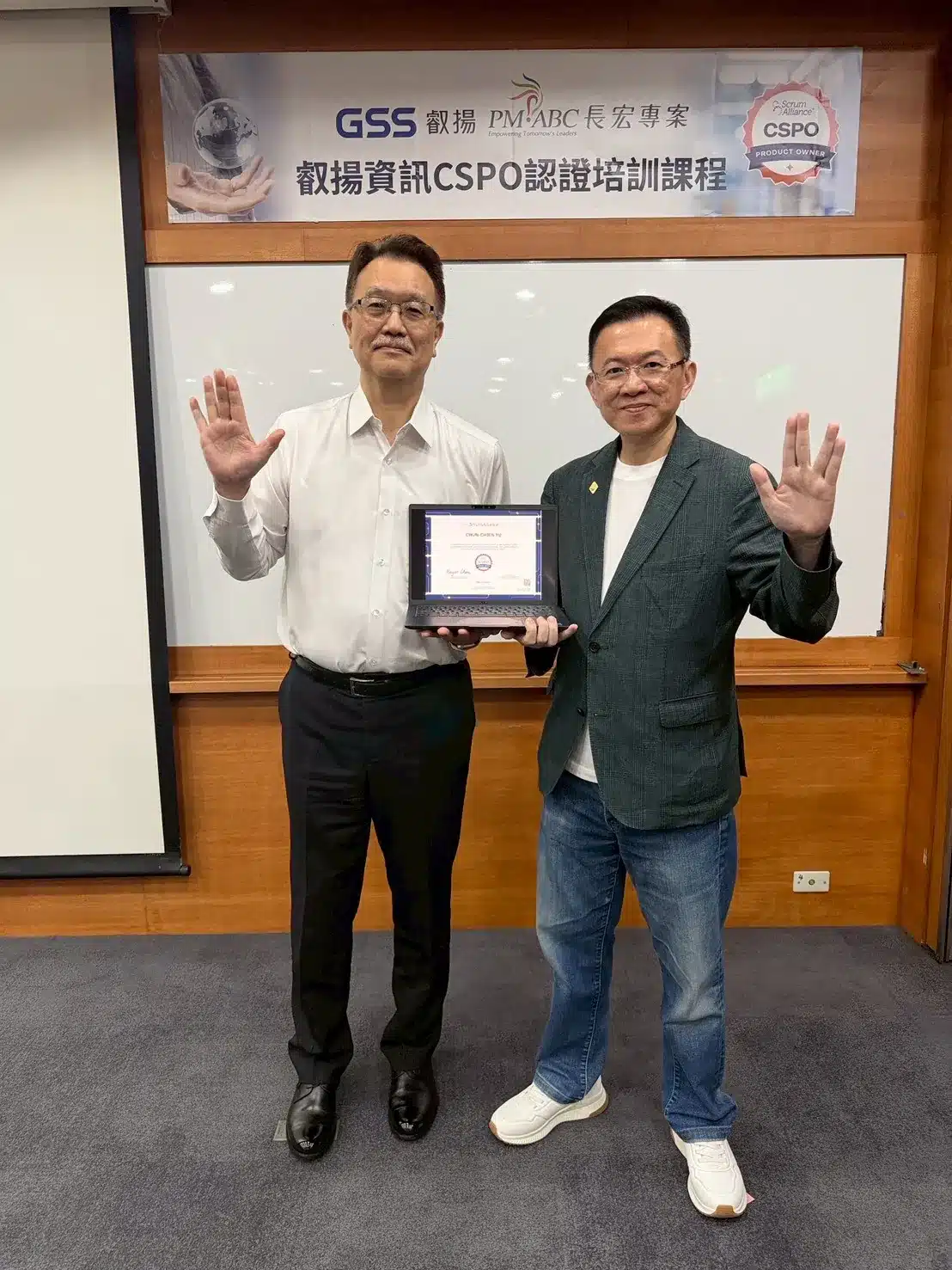 After 50 Senior Executives Earned Their CSM, Why Did Galaxy Software Send the General Manager, Directors, and POs Back to Earn CSPO? 2 BG GM Chris with Roger, holding CSPO cert
