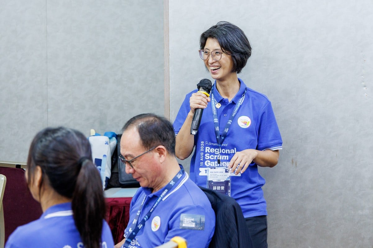 This Isn't Just Another Regional Scrum Gathering: When Scrum Walks Into the CEO's Decision Room 5 Facilitator Hsueh Pi-wen leading a table through dialogue