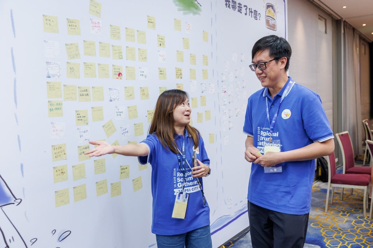 This Isn't Just Another Regional Scrum Gathering: When Scrum Walks Into the CEO's Decision Room 7 The co-creation wall, filled with sticky notes written by hand by over 200 attendees